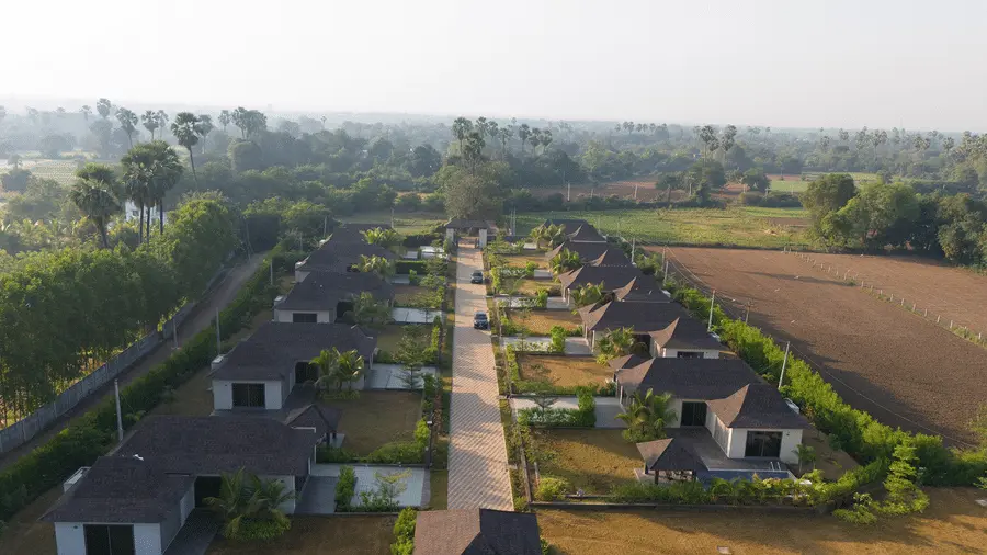 Aerial view of private pool villas and greenery