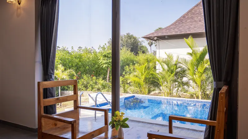 Scenic swimming pool view from villa window
