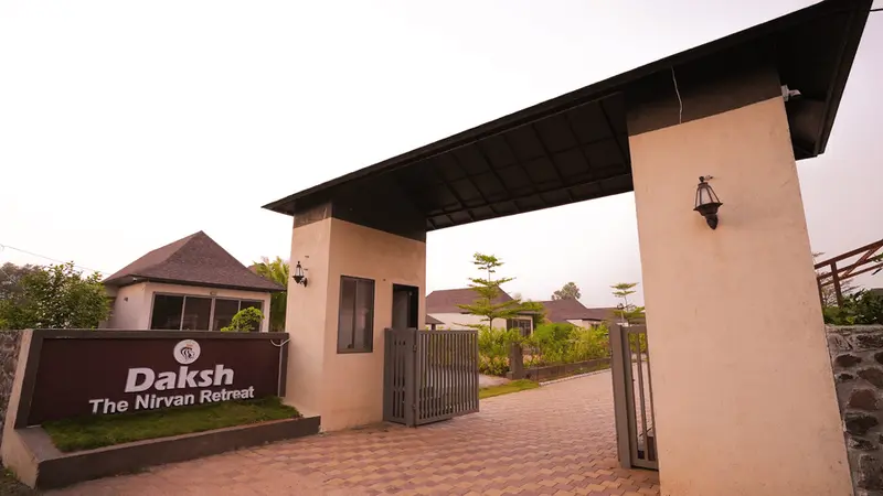 Elegant resort entrance gates of Nirvana Retreat Pavagadh