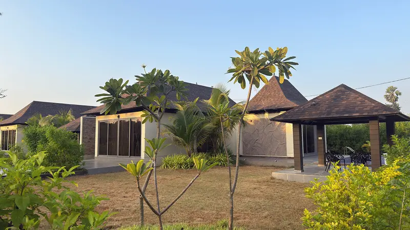 Lush green resort villas and palm trees